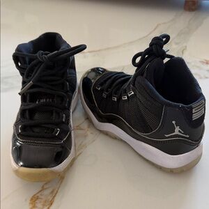 Jordan 11’s Kids Black and White Sneakers size 11